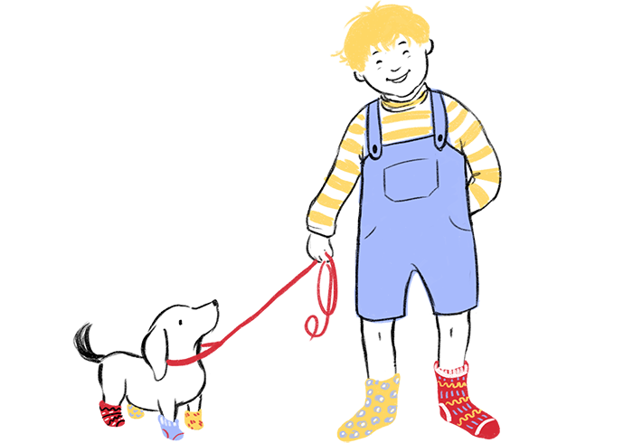 Boy and a dog wearing mismatched socks