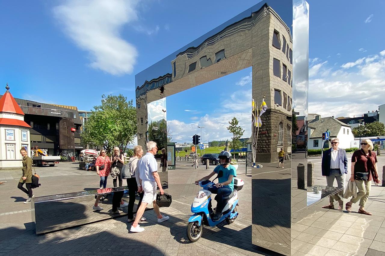 People enjoying art in the center of Reykjavík during the summer