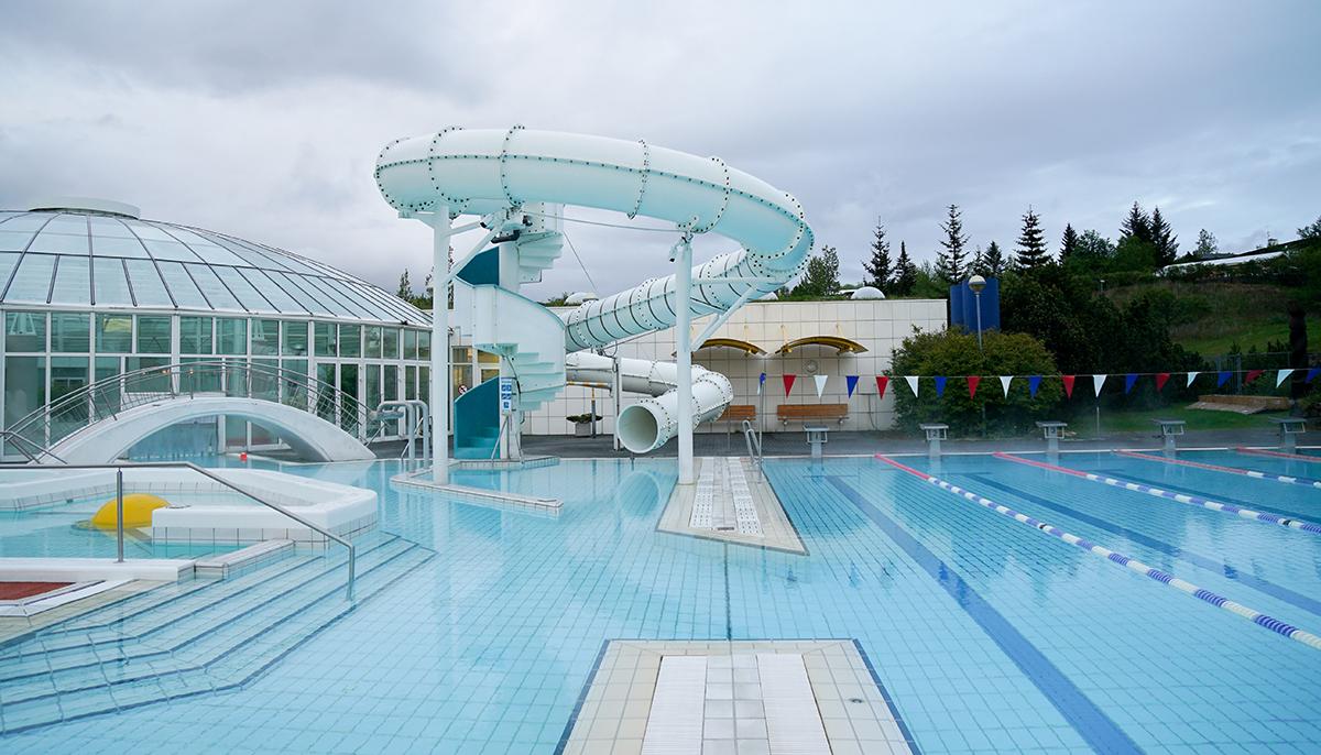 Slide and outdoor facilities at Árbæjarlaug