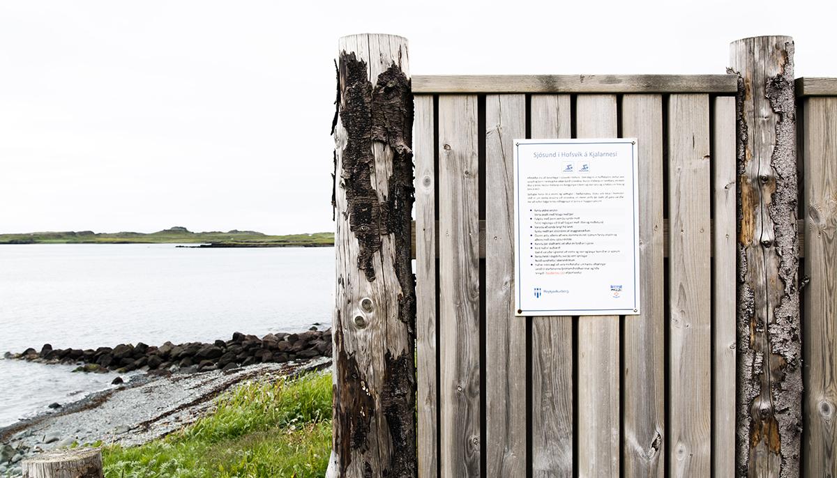 Information sign about ocean swimming at Hofsvík near Klébergslaug