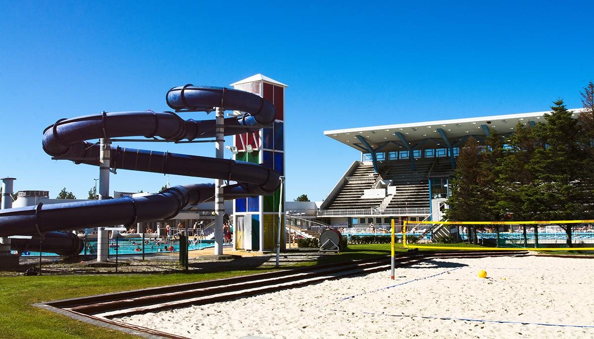 Beach volleyball court, large slide and grandstand at Laugardalslaug