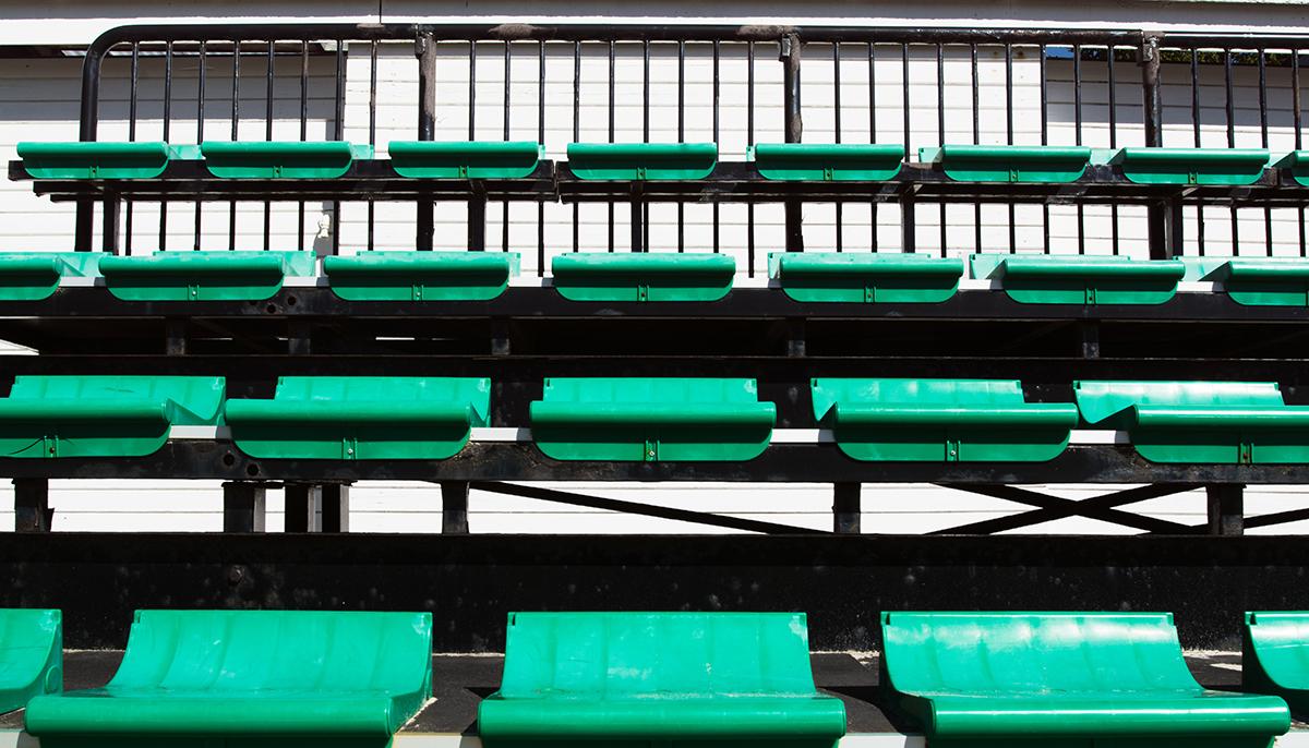 Grandstand seating overlooking beach volleyball courts at Laugardalslaug