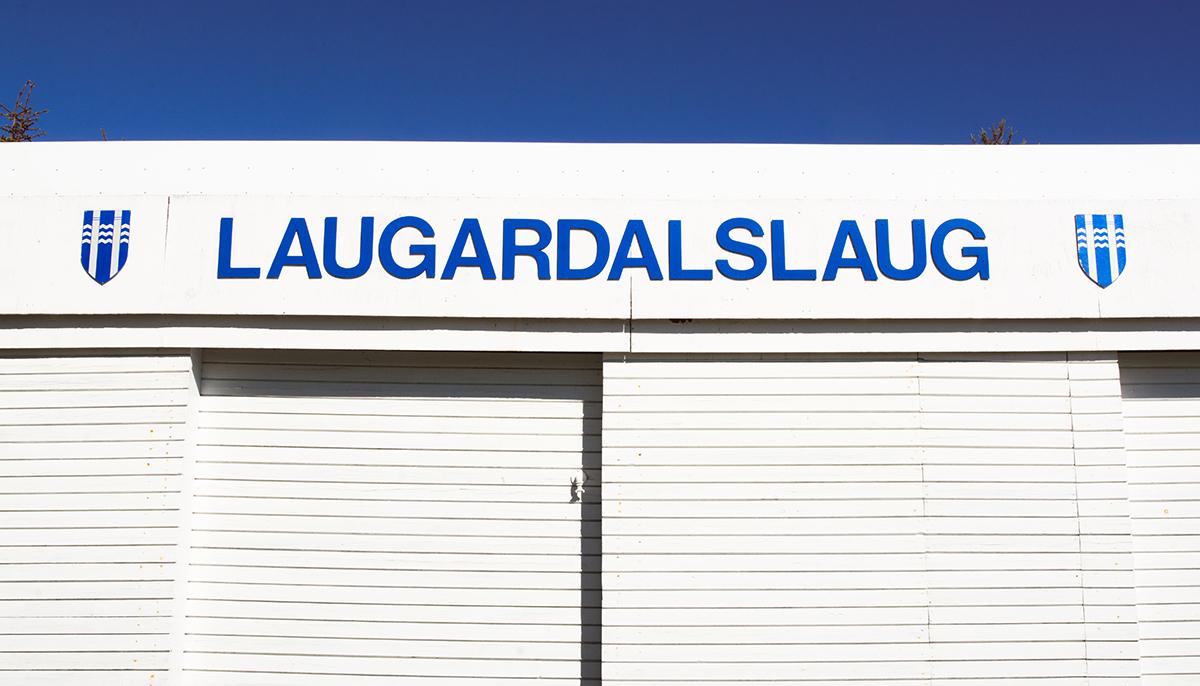 Laugardalslaug sign and Reykjavík City logo on poolside storage sheds