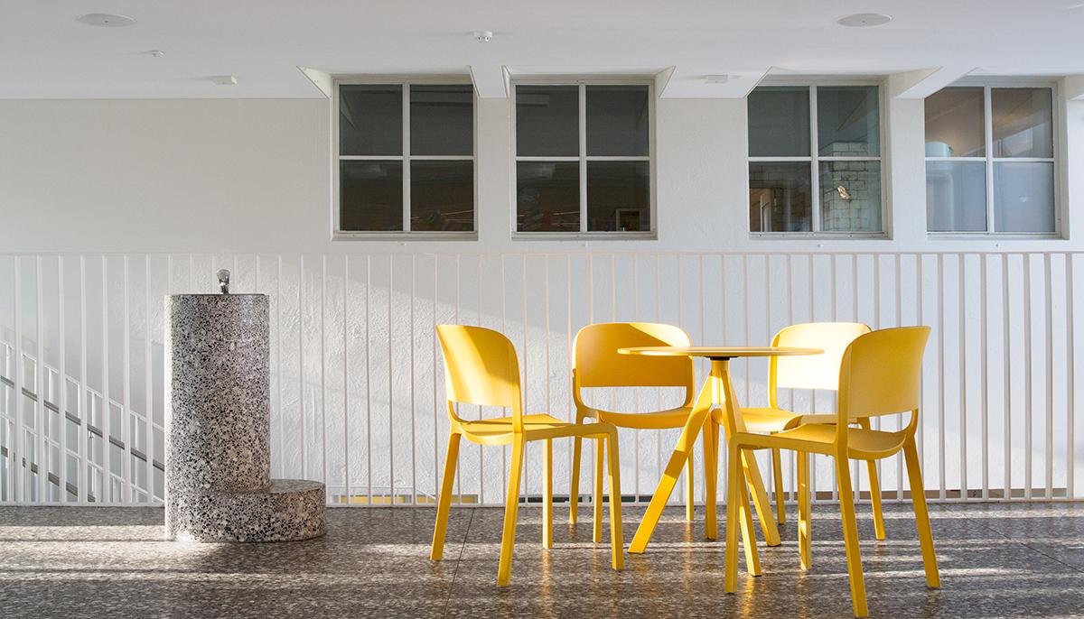 Tables and chairs in the lobby of Sundhöll Reykjavík