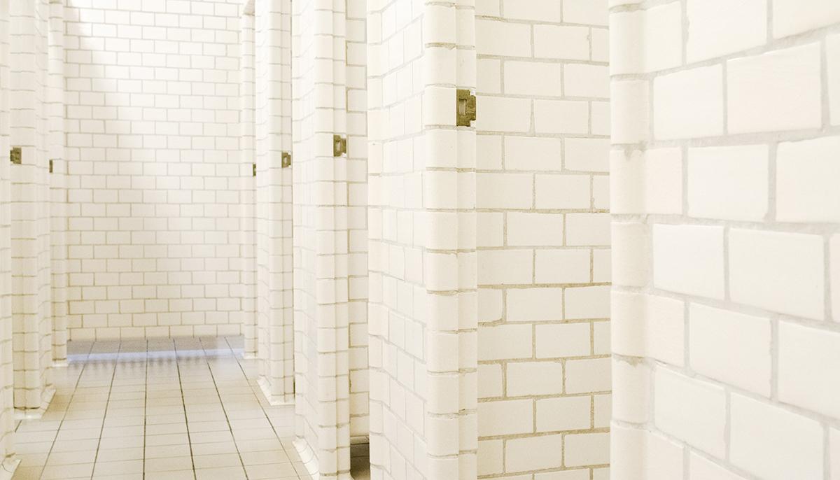 Old individual stalls in the men's changing room at Sundhöll Reykjavík