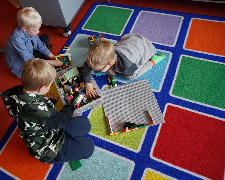 Preschool children playing Lego