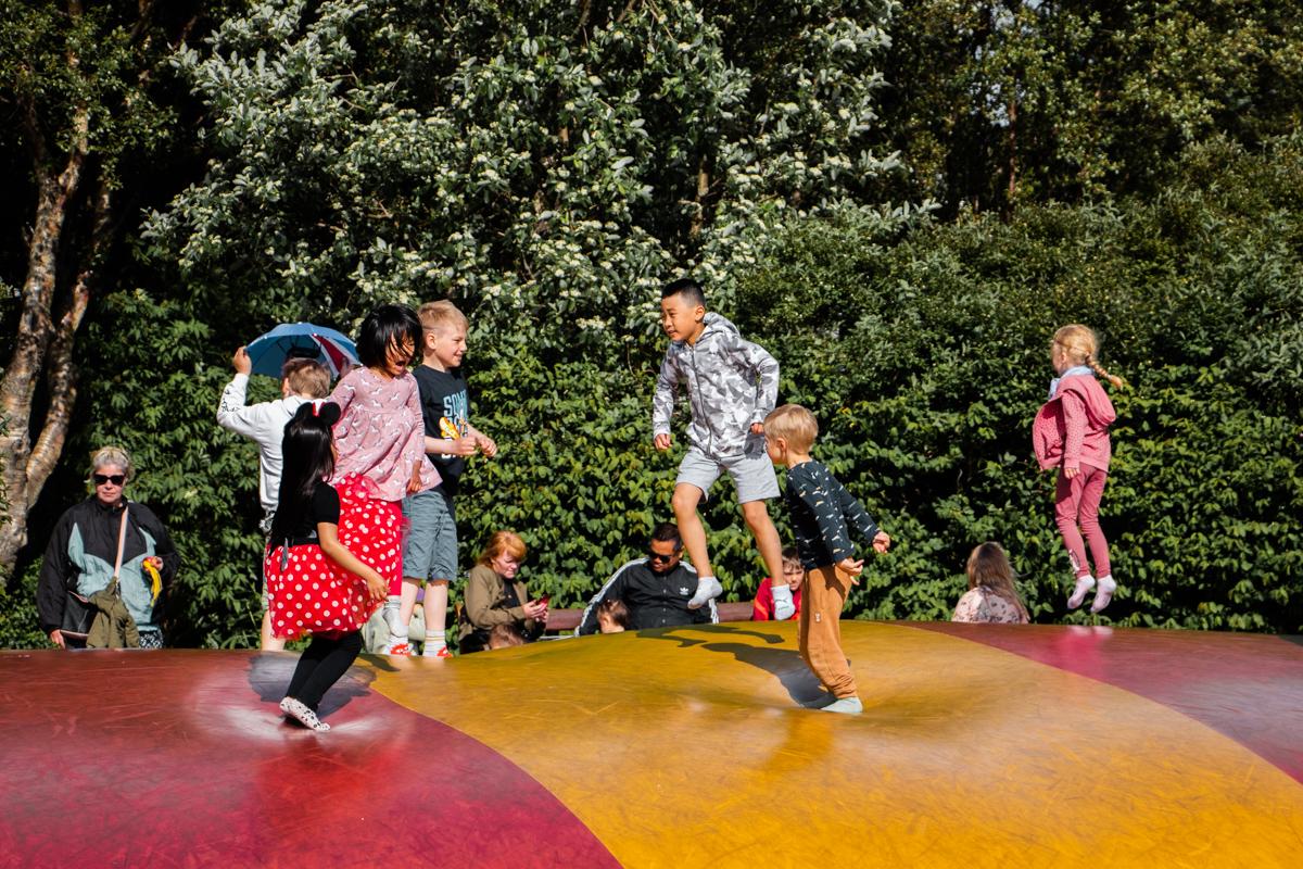 Children playing on the bouncy castle in the Family Park