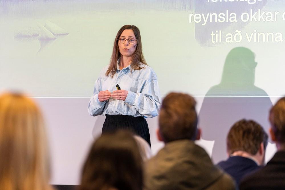 Margrét Ormslev Ásgeirsdóttir delivers her presentation at the meeting.