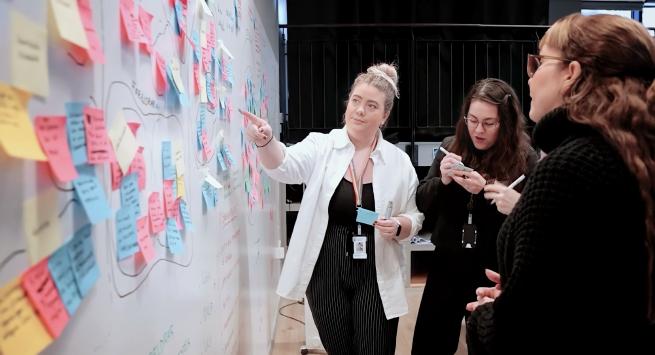 Workshop facilitator reviewing ideas.