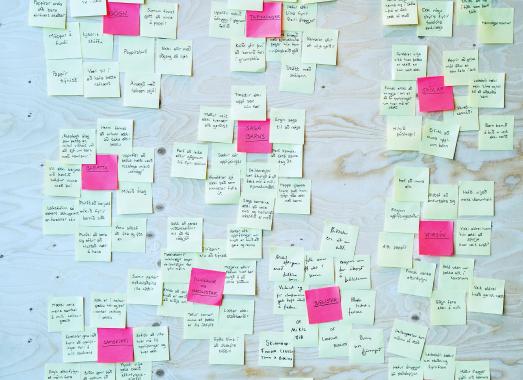 Post-it notes on a wall.